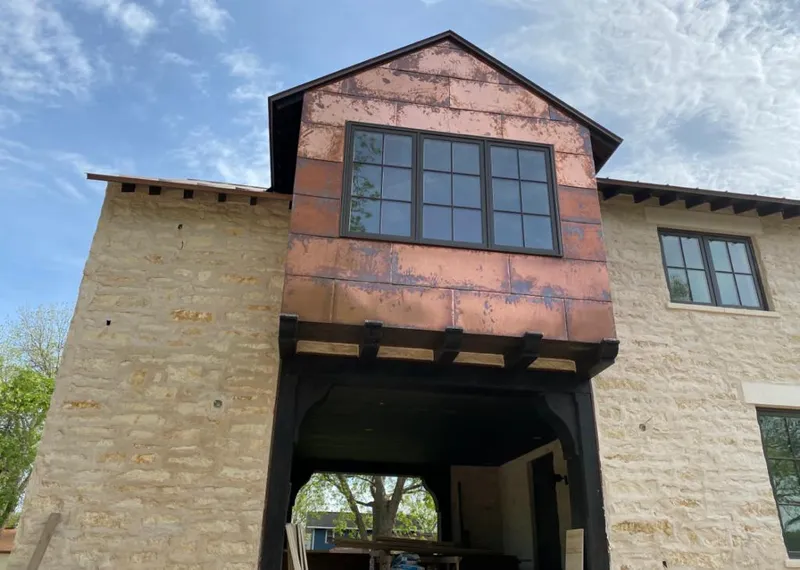 Copper metal panel facade on a stone building for Skylight Installation in Blairstown